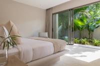 Ein Bett oder Betten in einem Zimmer der Unterkunft Cielo Boutique Hotel & Spa Samui