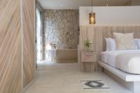 Ein Bett oder Betten in einem Zimmer der Unterkunft Cielo Boutique Hotel & Spa Samui