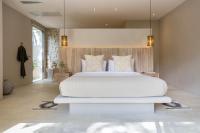 Ein Bett oder Betten in einem Zimmer der Unterkunft Cielo Boutique Hotel & Spa Samui