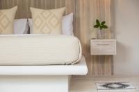 Ein Bett oder Betten in einem Zimmer der Unterkunft Cielo Boutique Hotel & Spa Samui