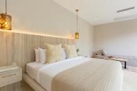Ein Bett oder Betten in einem Zimmer der Unterkunft Cielo Boutique Hotel & Spa Samui