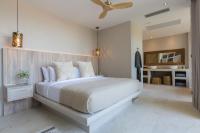 Ein Bett oder Betten in einem Zimmer der Unterkunft Cielo Boutique Hotel & Spa Samui