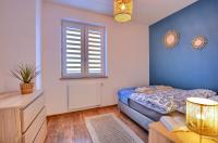 Posteľ alebo postele v izbe v ubytovaní Apartamenty Maja i Zuzia