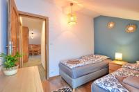 Posteľ alebo postele v izbe v ubytovaní Apartamenty Maja i Zuzia