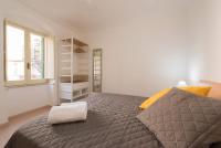 Posteľ alebo postele v izbe v ubytovaní Duomo Seaside Deluxe Apartment by Ortigia Apartments