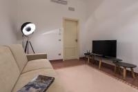 Televízia a/alebo spoločenská miestnosť v ubytovaní Duomo Seaside Deluxe Apartment by Ortigia Apartments