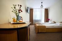 Łóżko lub łóżka w pokoju w obiekcie Hotel Zamek