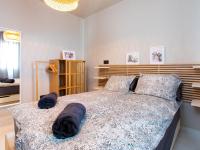 Postel nebo postele na pokoji v ubytování Holiday Home Melon by Interhome