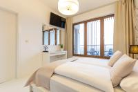 Posteľ alebo postele v izbe v ubytovaní VacationClub - Olympic Park Apartament A602