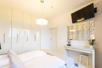 Posteľ alebo postele v izbe v ubytovaní VacationClub - Olympic Park Apartament A602