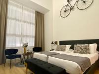 Postel nebo postele na pokoji v ubytování INTOMILAN Galleria Duomo I Boutique & Design Aparthotel