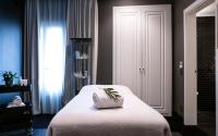 a bedroom with a bed with a pillow on it at The Principal Madrid, Small Luxury Hotels in Madrid