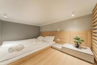 A bed or beds in a room at ZEUS Design Mini Holliday Embel #23