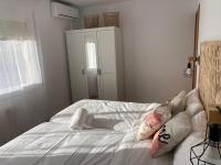 A bed or beds in a room at Vilamarlux VI