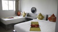 Ein Bett oder Betten in einem Zimmer der Unterkunft Samui Beach Residence Hotel