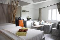 Ein Bett oder Betten in einem Zimmer der Unterkunft Samui Beach Residence Hotel