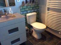 a bathroom with a white toilet and a sink at Domaine Castelsec in Roquefort-des-Corbières