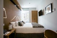 Posteľ alebo postele v izbe v ubytovaní Legazpi Doce Rooms & Suites