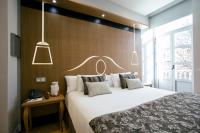 Posteľ alebo postele v izbe v ubytovaní Legazpi Doce Rooms & Suites