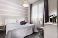 A bed or beds in a room at Hotel Star