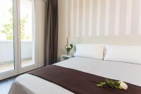A bed or beds in a room at Hotel Star