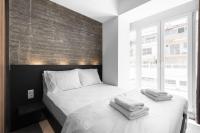 Posteľ alebo postele v izbe v ubytovaní Adelle Apartments, The Luxury Suites