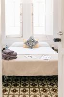 A bed or beds in a room at Mapango Small Rooms
