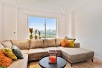 a living room with a couch and a large window at Vakantiewoning in het landelijke Staden! 10 pers - STAEDENBERGH in Staden