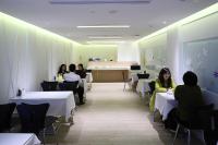 a group of people sitting at tables in a restaurant at Hsiangkelira Hotel in Kaohsiung