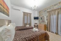 Posteľ alebo postele v izbe v ubytovaní Faraggi Villas