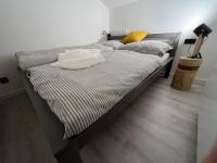 Postel nebo postele na pokoji v ubytování Apartmány Panorama Harrachov