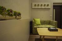 a living room with a couch and a table at Yesday B&amp;B in Dongshan