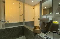 a bathroom with a sink and a shower at Yesday B&amp;B in Dongshan