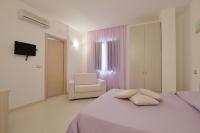Posteľ alebo postele v izbe v ubytovaní Hotel La Marina