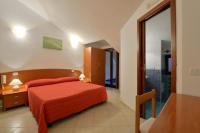 Posteľ alebo postele v izbe v ubytovaní Hotel La Marina