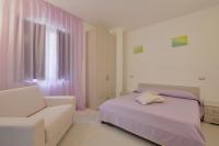 Posteľ alebo postele v izbe v ubytovaní Hotel La Marina