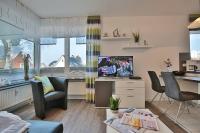 TV a/nebo společenská místnost v ubytování Haus am Wiesenweg Haus am Wiesenweg 3 Appartement 04