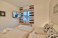 Postel nebo postele na pokoji v ubytování Haus am Wiesenweg Haus am Wiesenweg 3 Appartement 04
