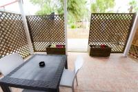 A seating area at Giardini Sausari Residence
