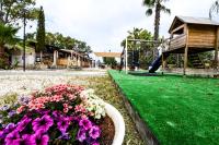 A garden outside Giardini Sausari Residence