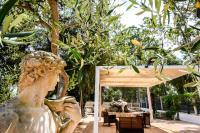 A garden outside Giardini Sausari Residence
