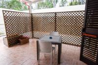 A patio or other outdoor area at Giardini Sausari Residence