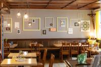 a dining room with wooden tables and chairs at Hotel Restaurant Grüner Baum und Altes Tor in Bad Waldsee