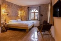 Postel nebo postele na pokoji v ubytování Cappadocia Naif Hotel - Adults Only