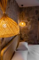 Postel nebo postele na pokoji v ubytování Cappadocia Naif Hotel - Adults Only