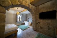 Postel nebo postele na pokoji v ubytování Cappadocia Naif Hotel - Adults Only