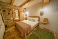 Postel nebo postele na pokoji v ubytování Cappadocia Naif Hotel - Adults Only