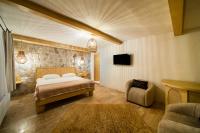 Postel nebo postele na pokoji v ubytování Cappadocia Naif Hotel - Adults Only
