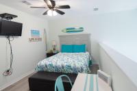 Ein Bett oder Betten in einem Zimmer der Unterkunft Grand Beach Resort Penthouse 1