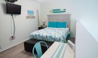 Ein Bett oder Betten in einem Zimmer der Unterkunft Grand Beach Resort Penthouse 1
